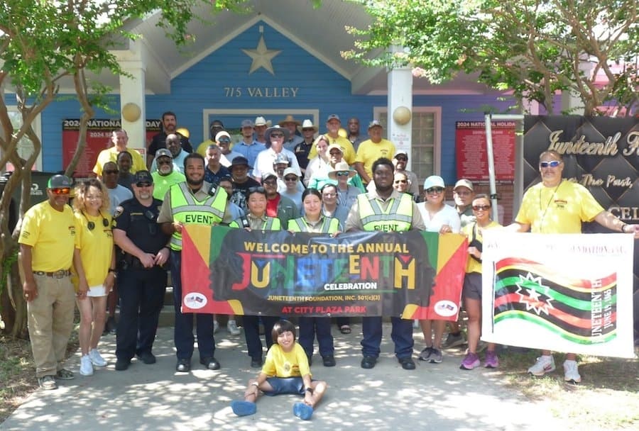A group of people pose outside during a previous Juneteenth walk.