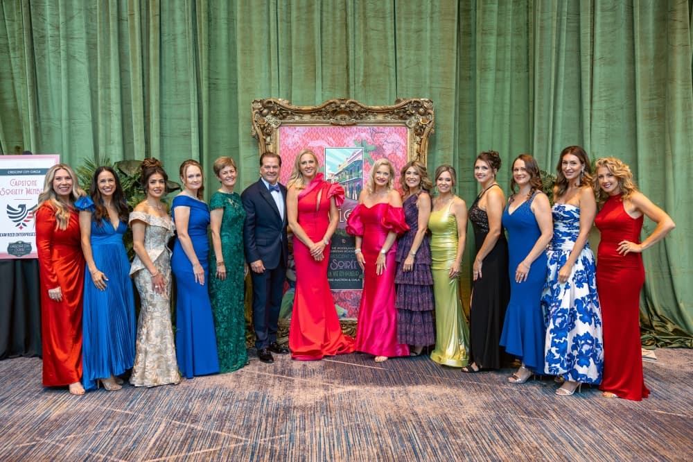 group of people lined up at gala