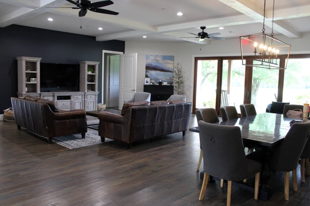 Interior of building with living room and dining room furniture. 