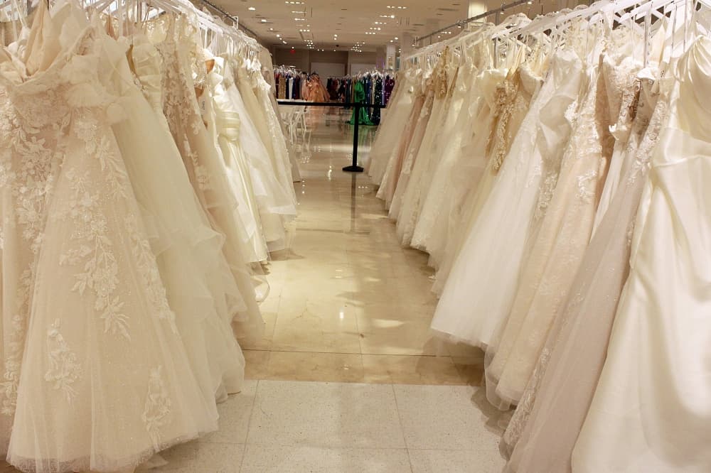 Aisle of wedding dresses. 