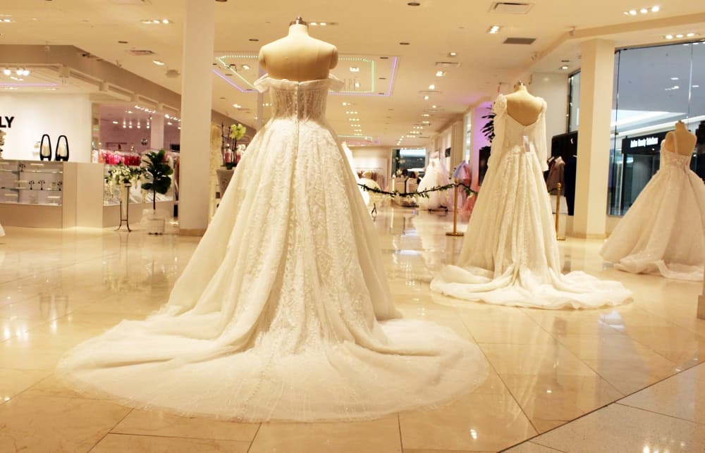 Back of wedding dresses in a bridal gown store. 