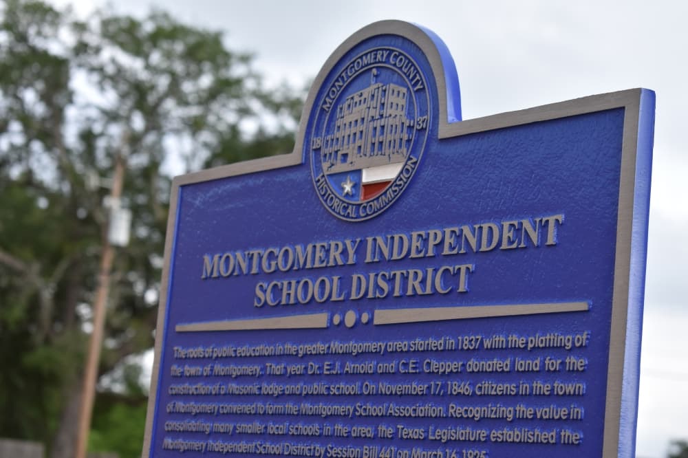 A new historical marker sits in front of Montgomery Elementary School after being unveiled on April 30. The marker commemorates 100 years of MISD. (Julianna Washburn/Community Impact)