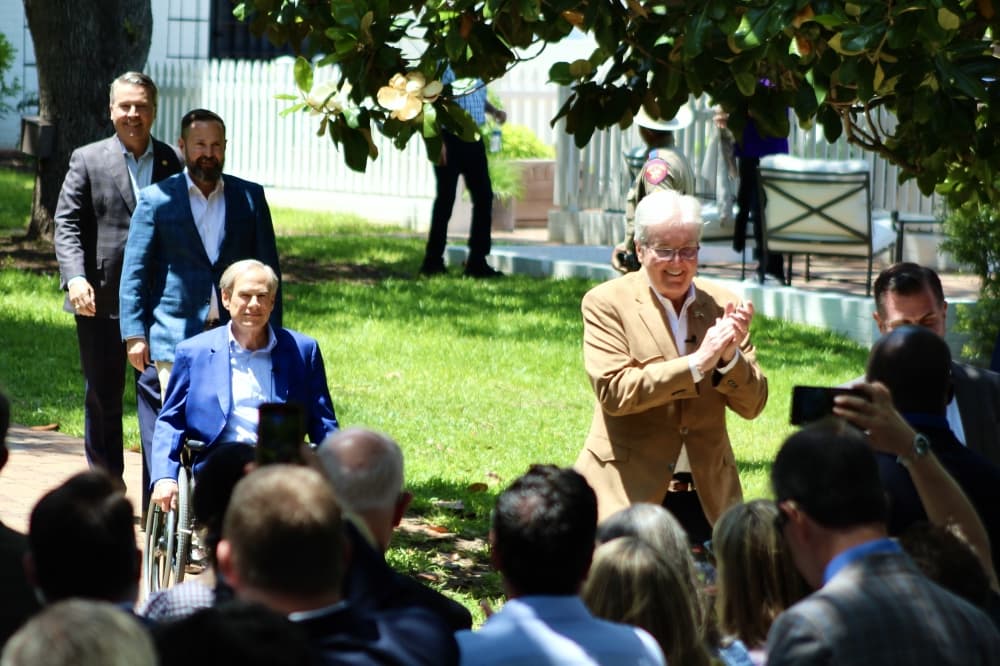 From left, Rep. Brad Buckley, R-Salado; House Speaker Dustin Burrows, R-Lubbock, Gov. Greg Abbott; and Lt. Gov. Dan Patrick enter a May 3 event during which Gov. Greg Abbott signed Senate Bill 2. (Hannah Norton/Community Impact)