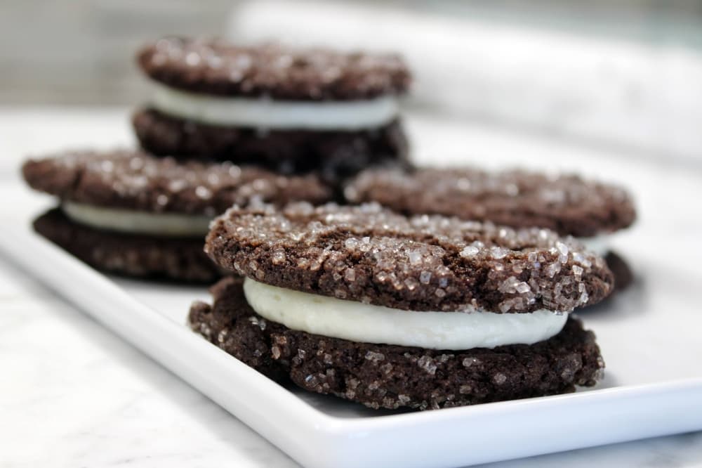 Chocolate cookie sandwich with white filling. 