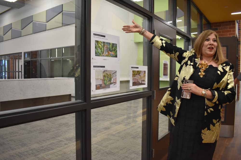 TISD Superintendent Martha Salazar-Zamora shows the library inside the new West Intermediate School on at a ribbon-cutting ceremony on May 2. (Community Impact/Julianna Washburn)