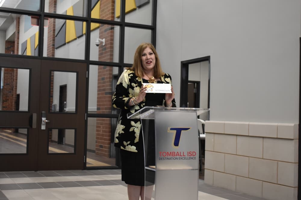 TISD Superintendent Martha Salazar-Zamora gives a speech at the ribbon-cutting ceremony for TISD's new intermediate school on May 2. (Community Impact/Julianna Washburn)