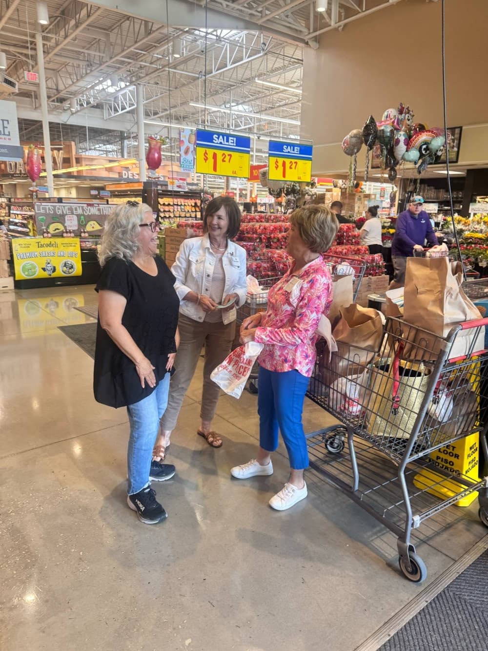 Kingwood Women's Club officials said local grocery stores provided support for the May 3 food drive. From left, a local shopper speaks with volunteers Judy Williams and Mary Tomes. (Courtesy Kingwood Women's Club) 