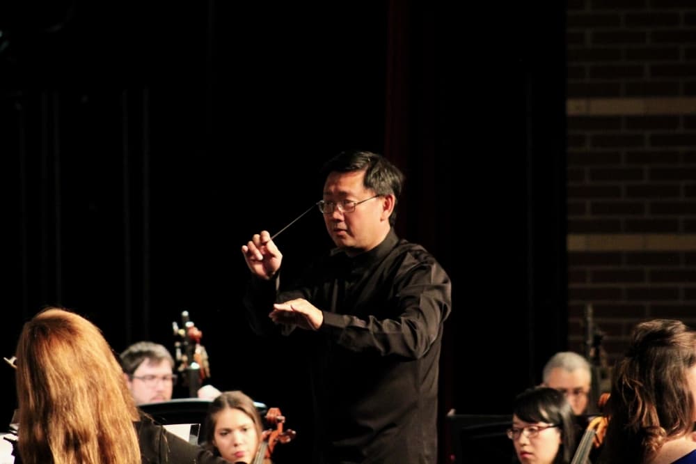 Image of Onductor Jason Lim leading the McKinney Philharmonic Orchestra