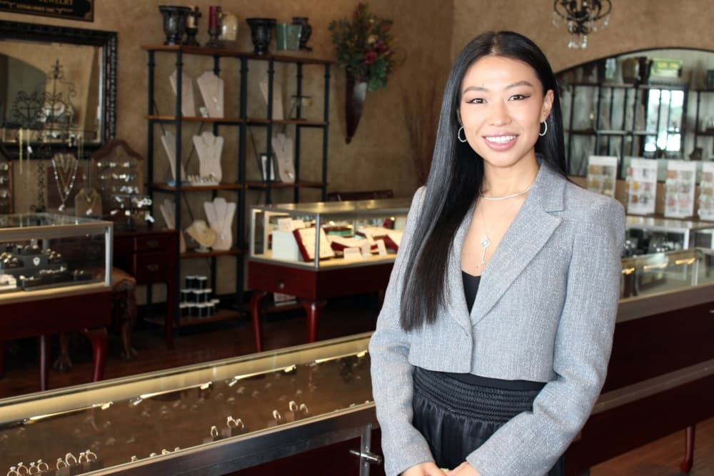 Female standing in a jewelry store. 