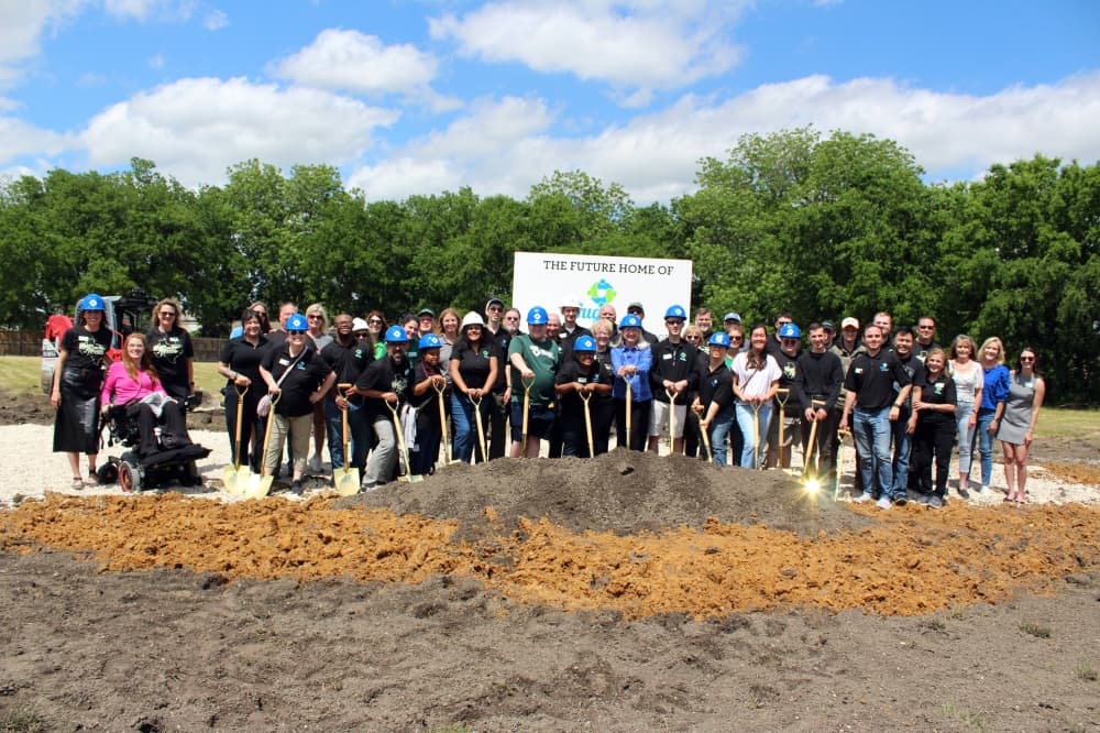 Hugs Cafe Inc. representatives break ground on new headquarters in McKinney