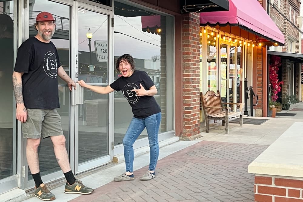 Matt and Jenna Bresnan in front of the storefront