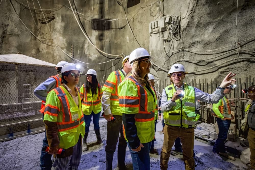 Workers underground in a tunnel 