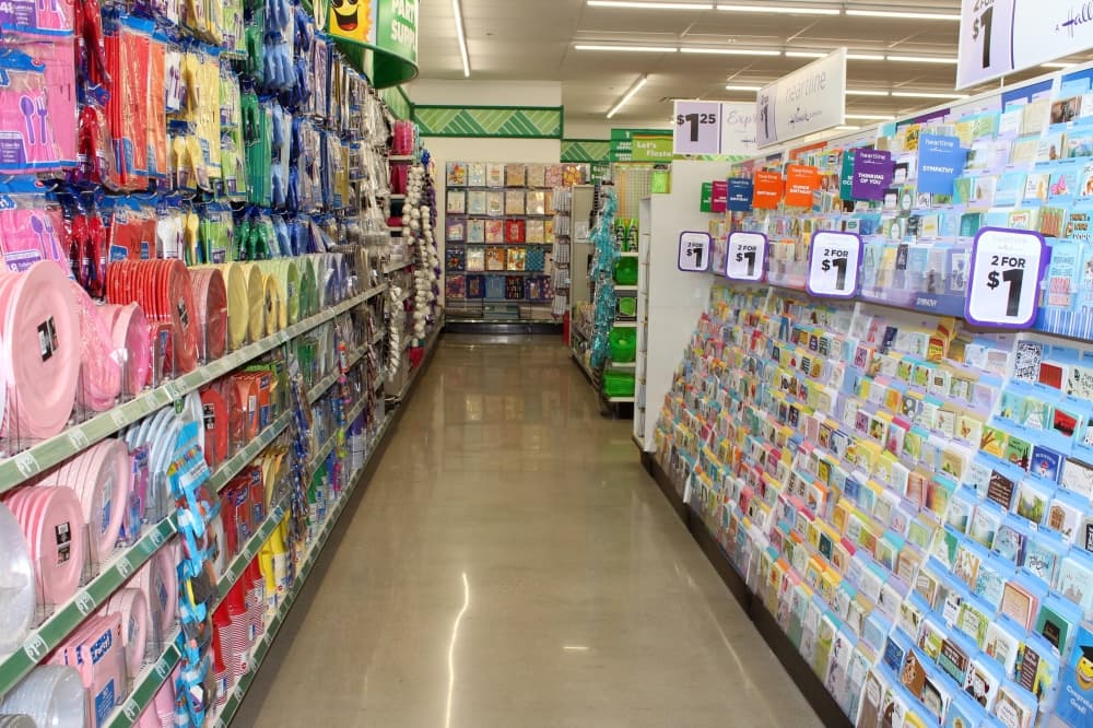 Store aisle with party supplies and greeting cards. 