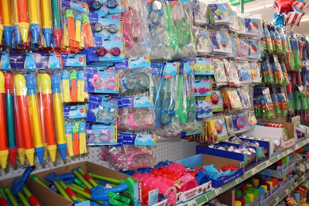 Summer retail items for children displayed in a store. 