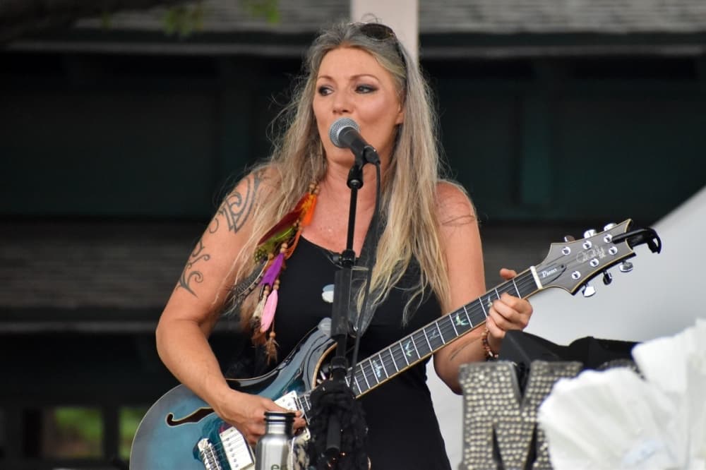 woman playing a guitar 
