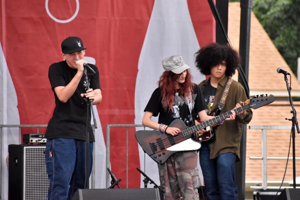 Students playing guitars
