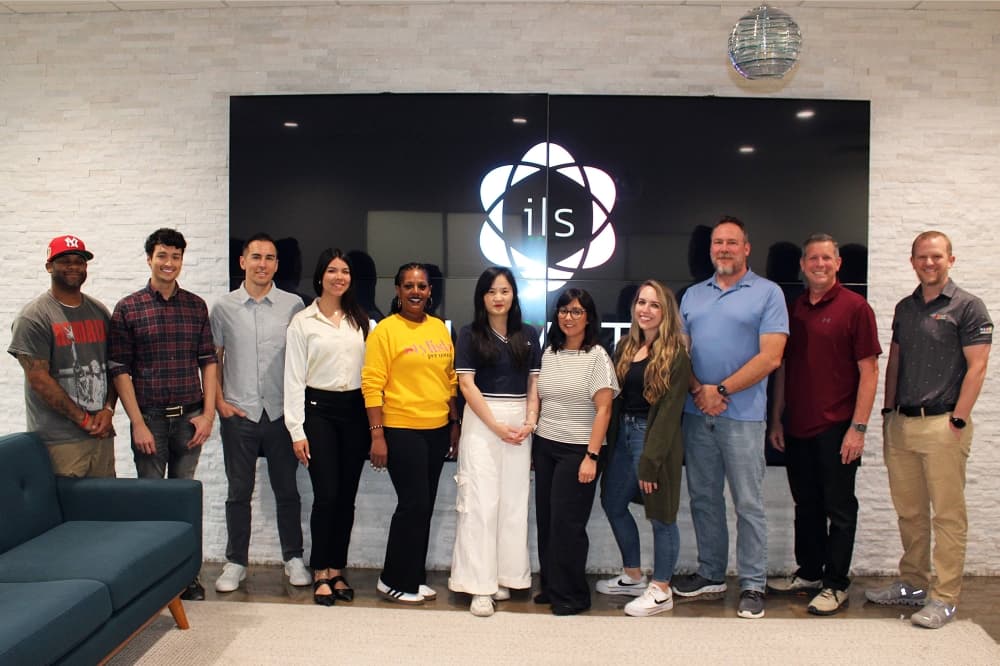 ILS leadership team, from left, Will Booth, Daniel Sanders, Dru Riess, Dayrelis Rivera, Lasonya Slade, Angie Xu, Siria Taylor, Ashlyn Thomas, Shawn Peterson, David Luke and Shane Davis. (Karen Chaney/Community Impact)