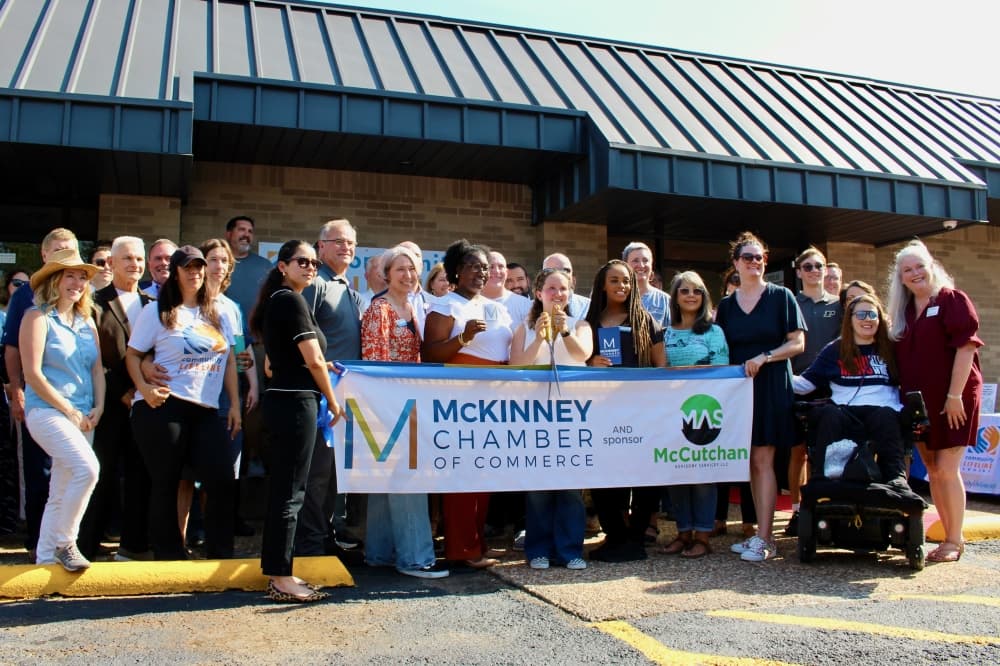 Group of people at a ribbon cutting