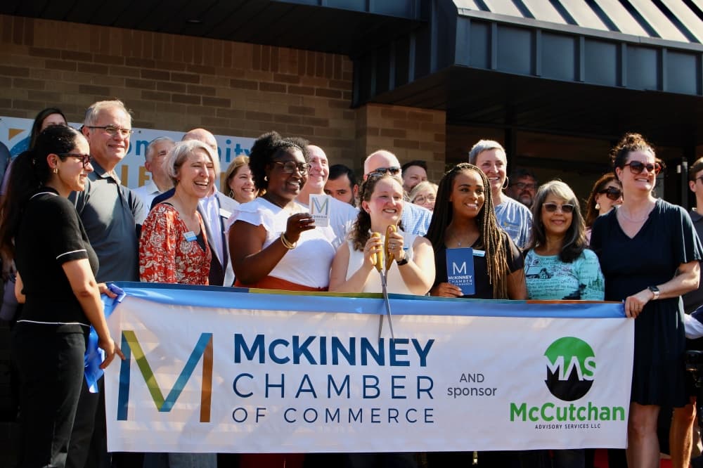 Group of people at a ribbon cutting