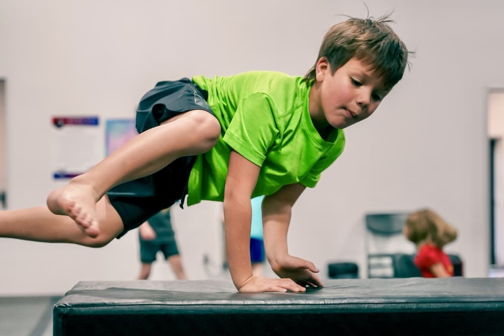 child doing obstacle course