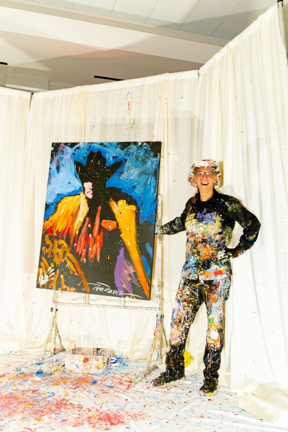 person stands with painting