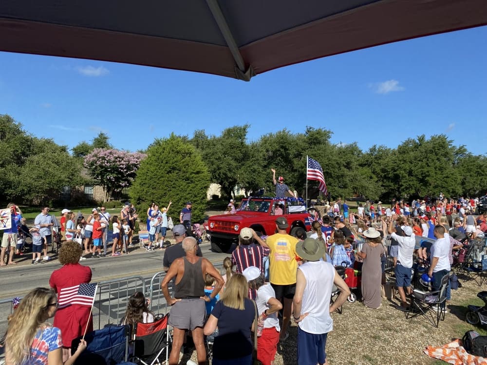 people lining streets for parade