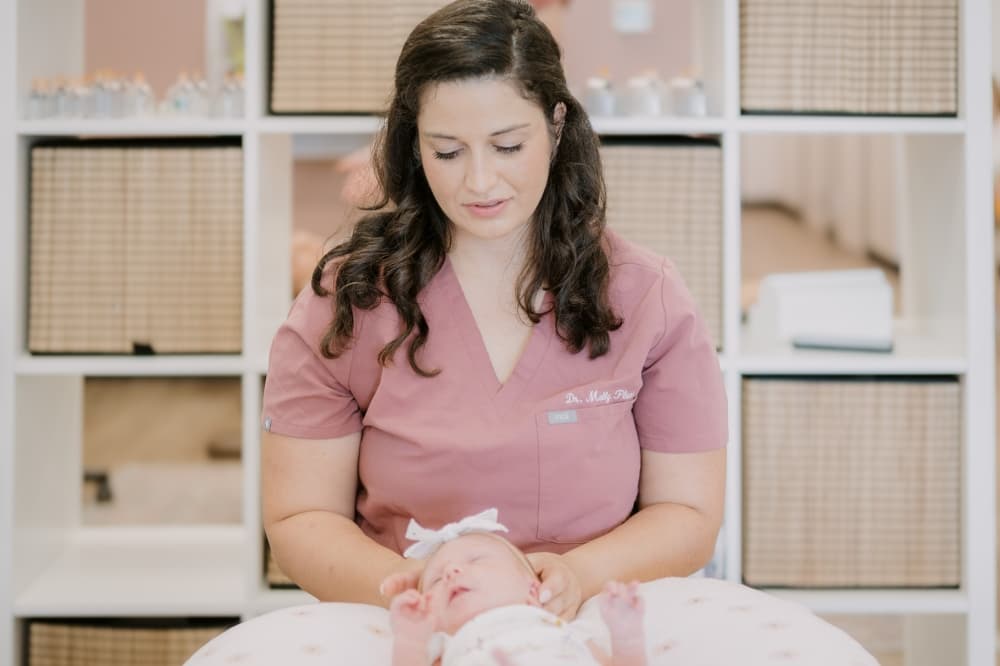 An image of a baby receiving services. 