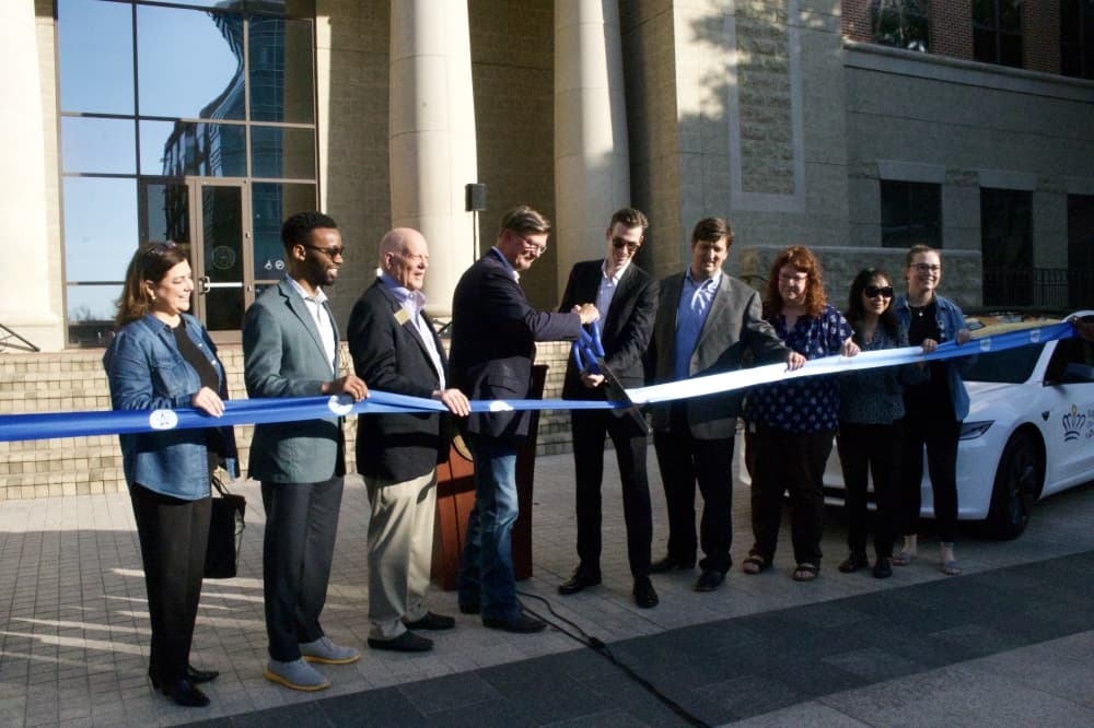 Sugar Land and Fort Bend County officials gathered April 9 to cut the ribbon on the on-demand microtransit service pilot program. (Aubrey Vogel/Community Impact)