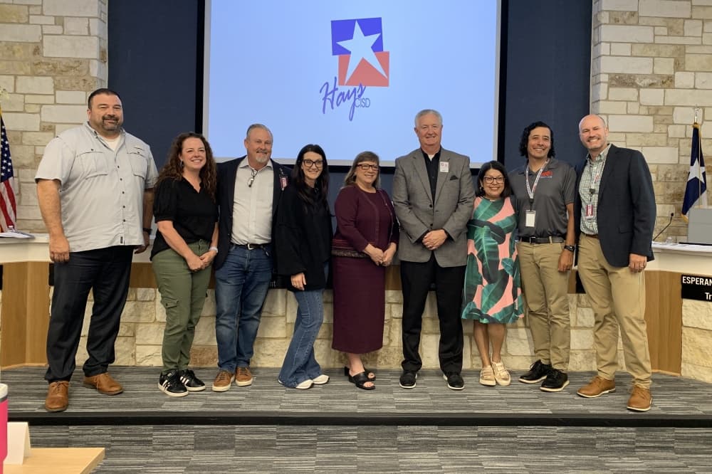 Hays CISD trustees and Superintendent Eric Wright (center, right) announced Deborah Ottmers (center) as the new district chief financial officer during a board meeting June 4. (Elisabeth Jimenez/Community Impact)
