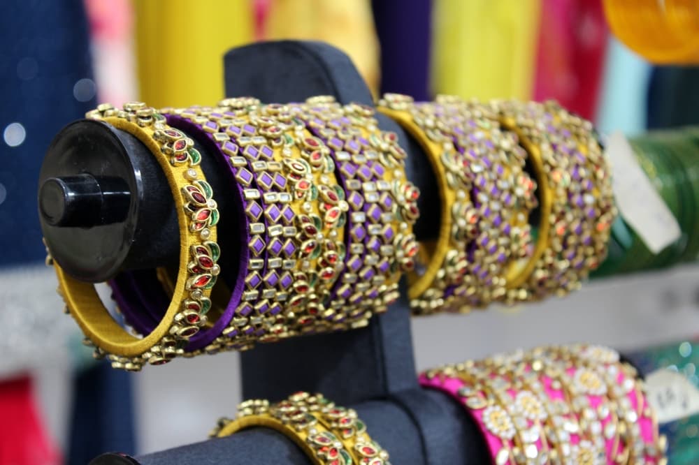 Beaded bracelets displayed in a store. 