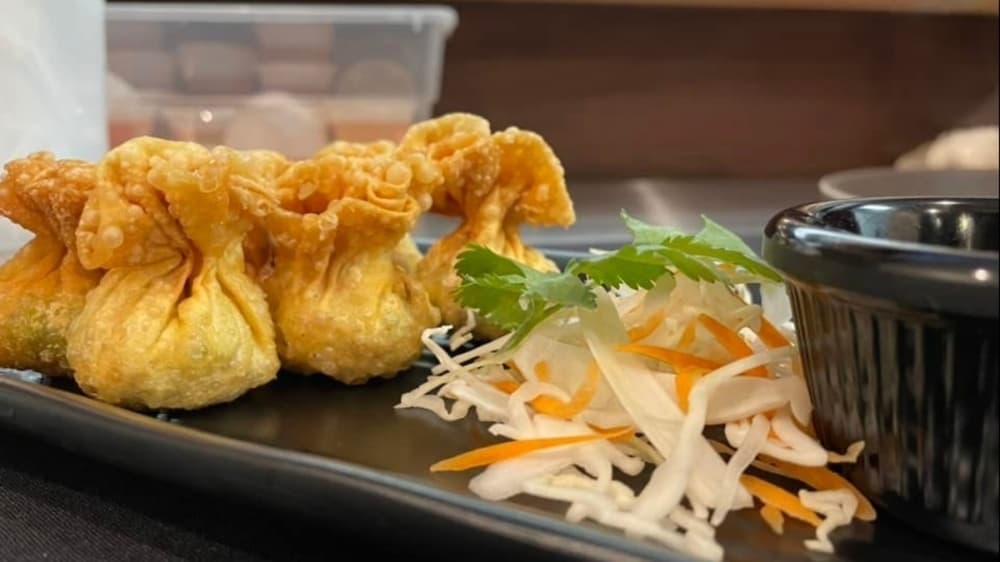 Fried food with side of vegetables. 