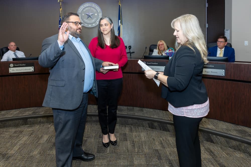 Recently elected Humble ISD Position 1 Trustee Oscar Silva, left, was sworn in to the district's board of trustees during their June 10 meeting. (Courtesy Humble ISD)