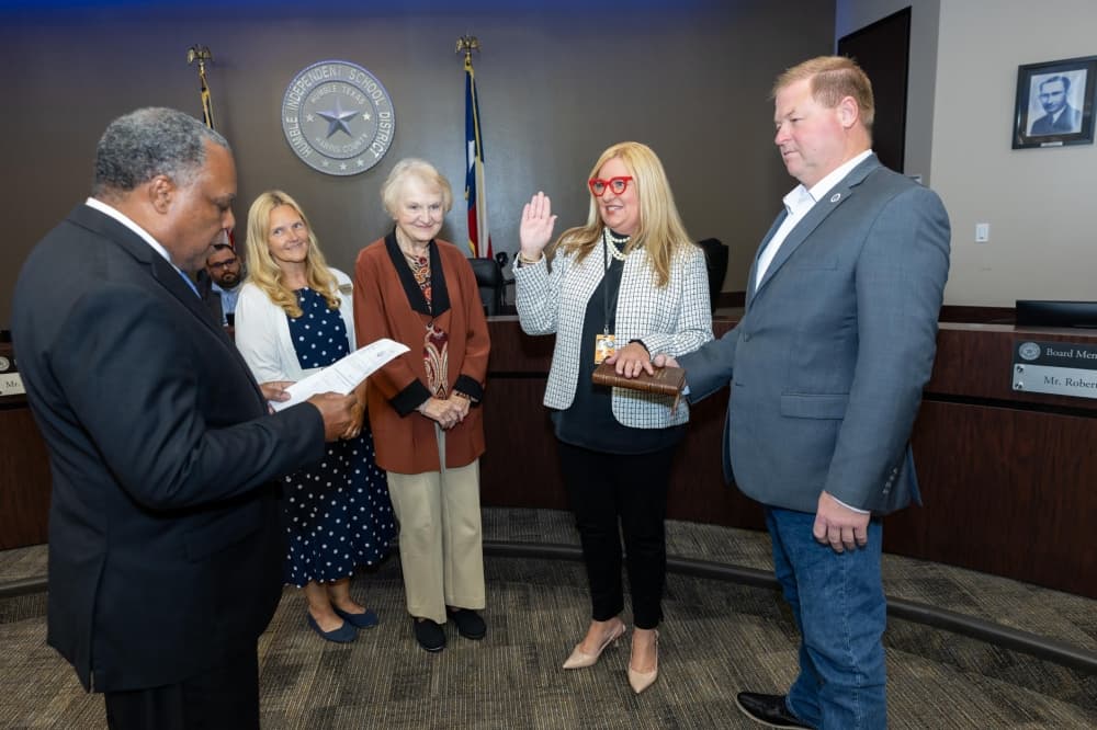 Humble ISD Position 3 Trustee Chris Parker, second from right, was sworn in to the district's board of trustees by former HISD trustee and current State Rep. Charles Cunningham, R-Humble, during the board's June 10 meeting. (Courtesy Humble ISD)