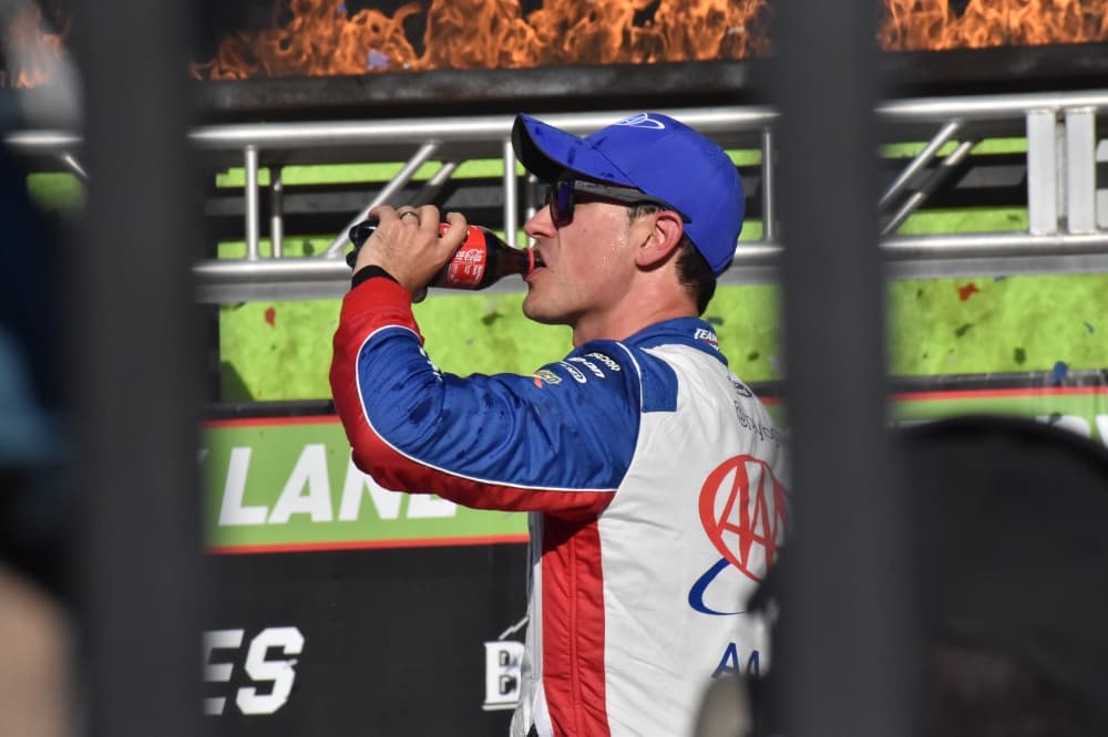Joey Logano drinking a coke 