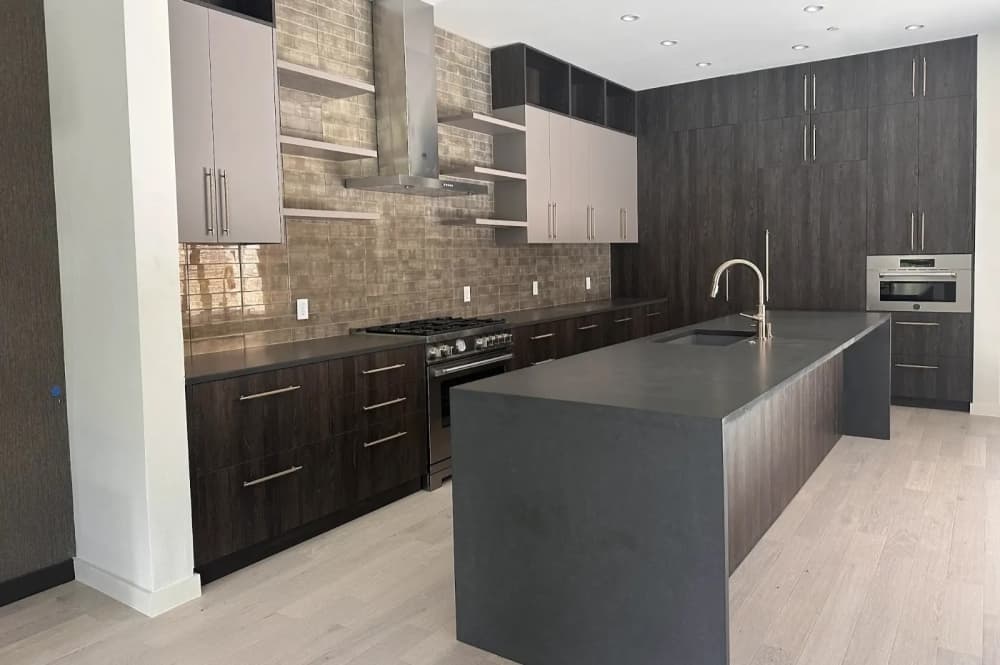 A kitchen with a bar island