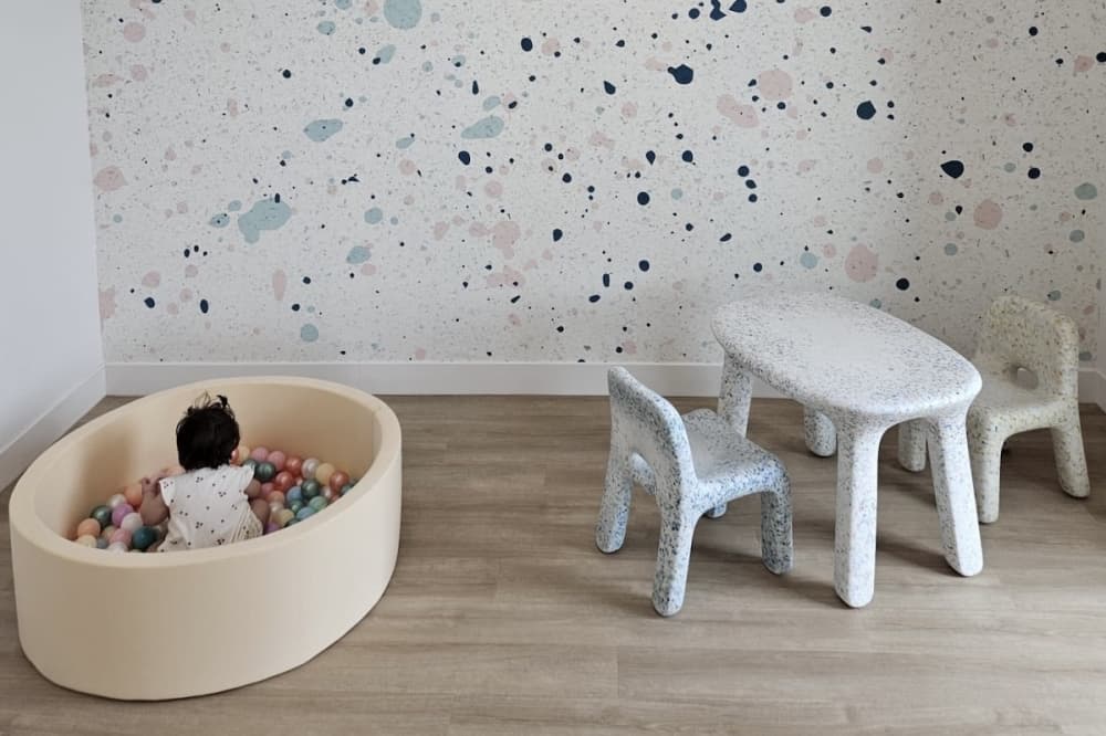a small ball pit and children's play table