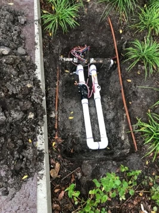 A photo of a new irrigation system in the soil.