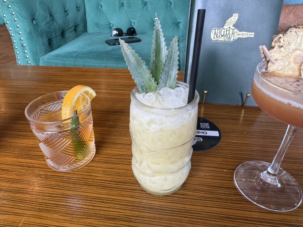 Some tropical cocktails on a table. 