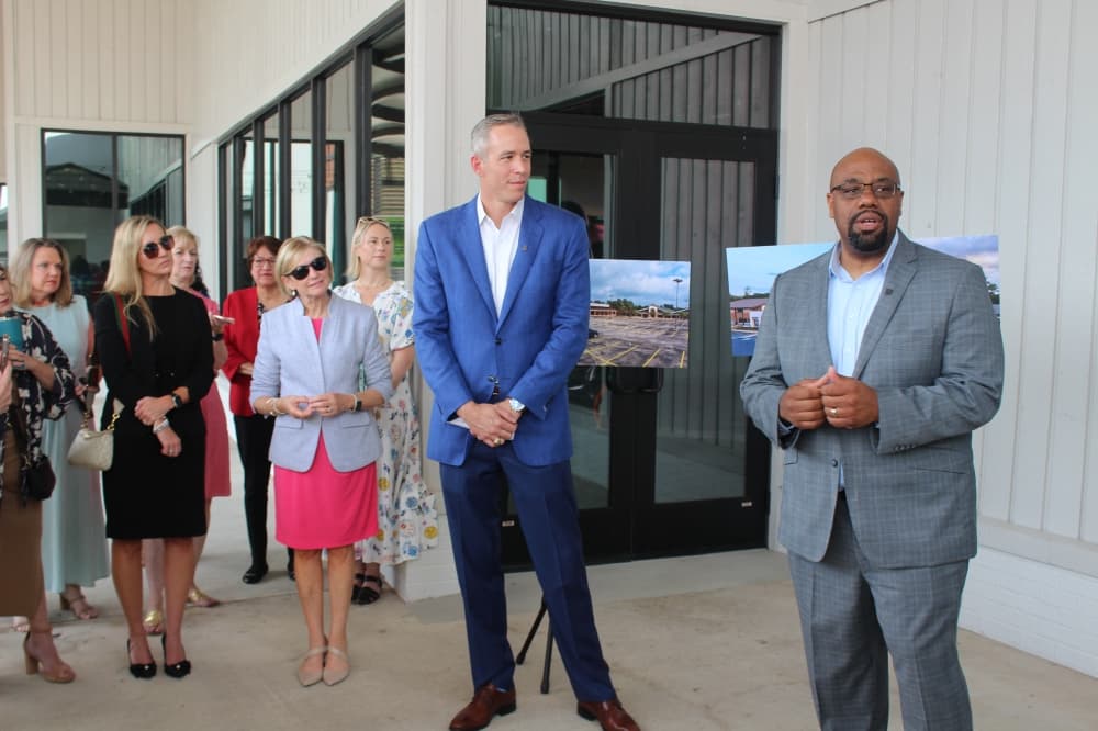 Jim Carman, Howard Hughes Houston region president, and Aaron Cox, The Woodlands Area Chamber president, gave remarks at the ribbon-cutting ceremony on June 25 (Jessica Shorten/Community Impact)