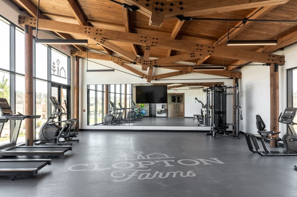 Modern fitness center inside Clopton Farms' new amenity facility. 