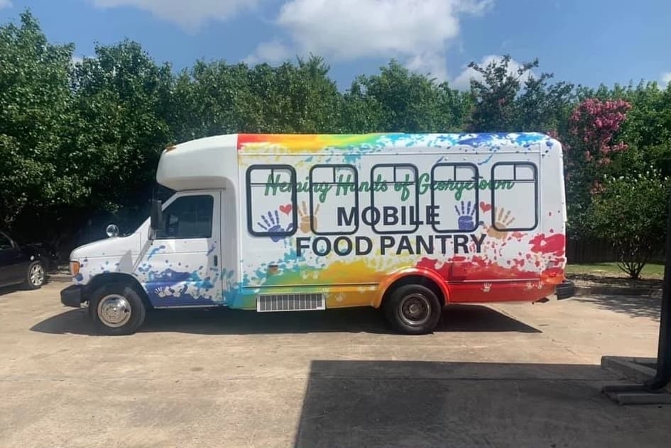 The Helping Hands of Georgetown mobile food pantry distributes lunch sacks on a weekly basis downtown to address food instability, Michelle Augustine said. 