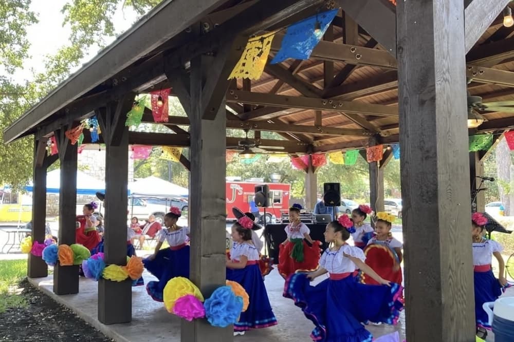 A group of dancers performs at a festival.