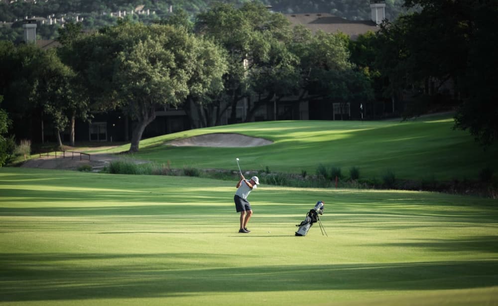 Golfer on Great Hills Country Club golf course 