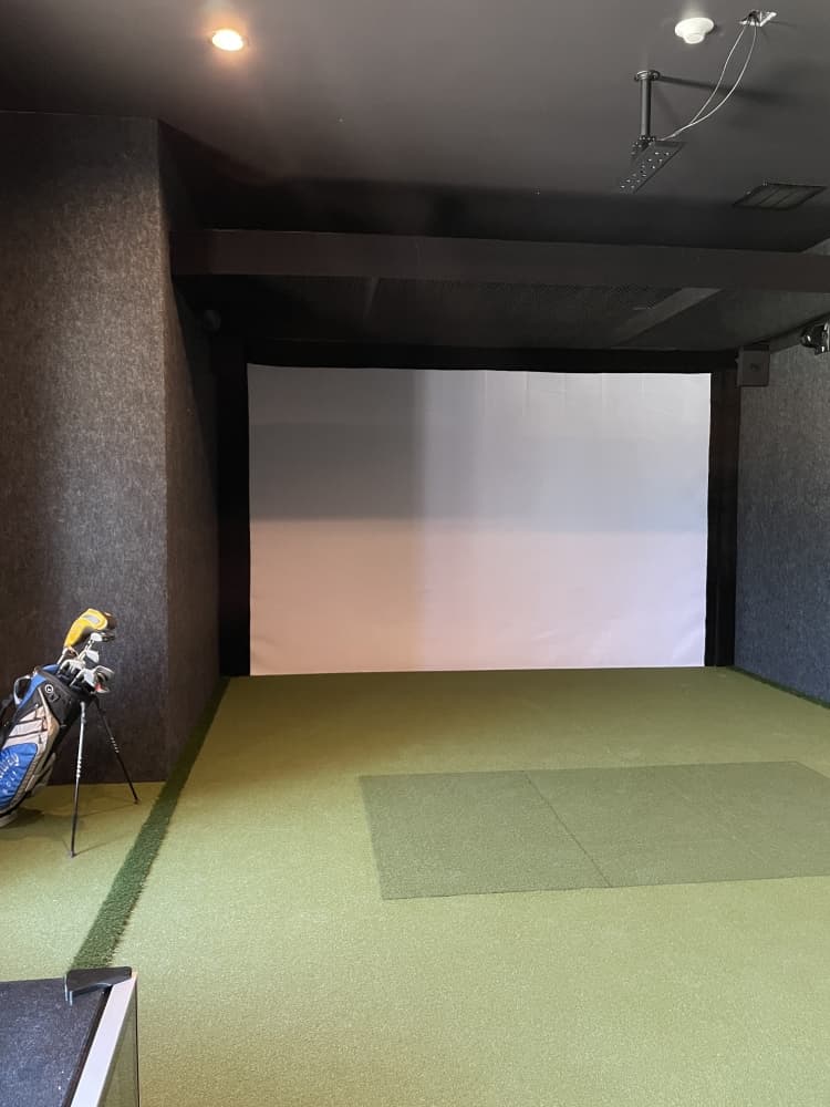 A simulation bay within The Back Nine Golf