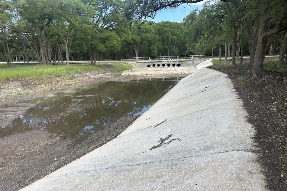 A drainage channel is seen in a neighborhood park in Cibolo, Texas.