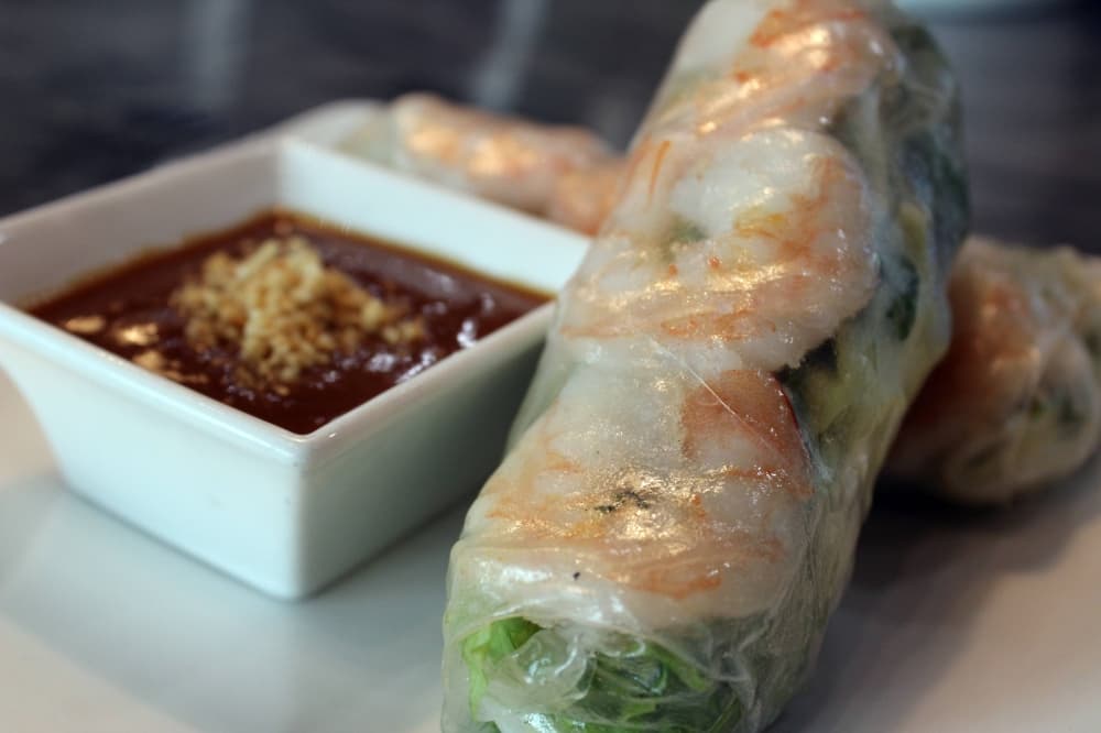 Clear wrapped spring rolls filled with shrimp and vegetables. 