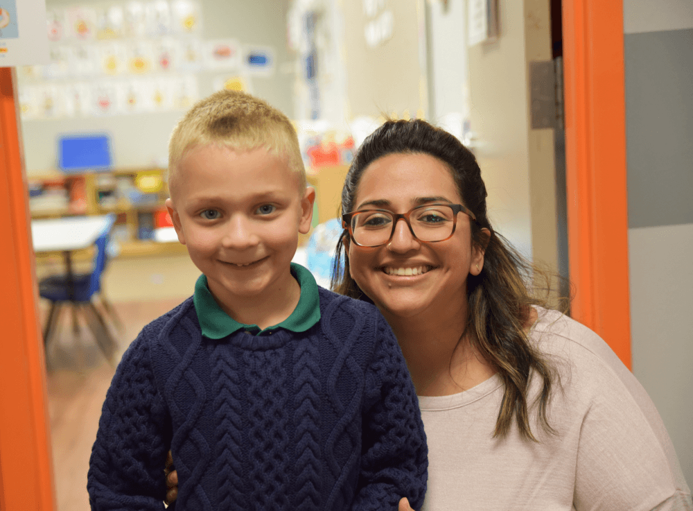 Elementary student poses proudly with his teacher at The Met Christian Academy, where personalized learning and strong relationships help children thrive in Tomball.