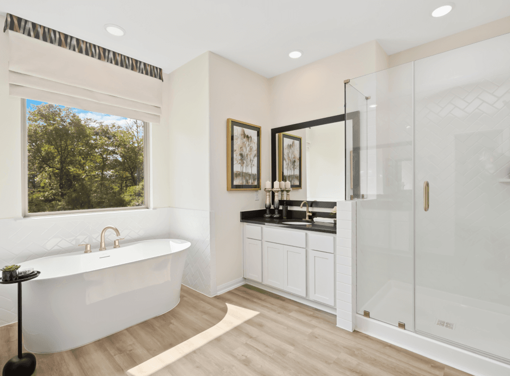 Spacious bathroom with modern finishes in a First America Homes new construction. 