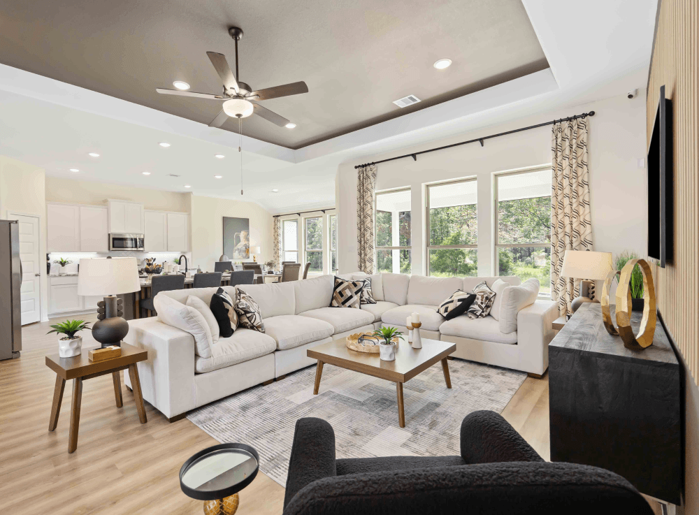 Open-concept living room in a First America Homes modern Texas home. 