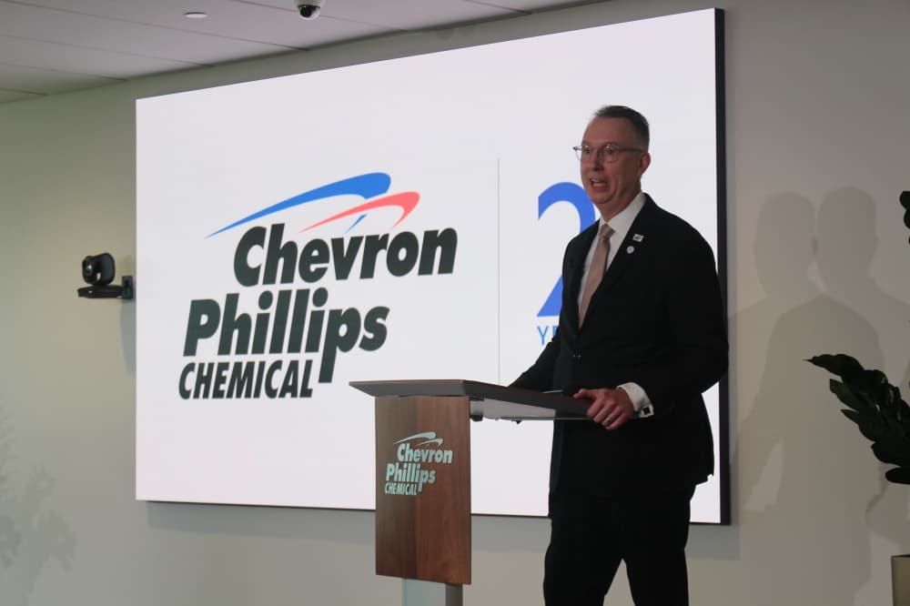 Steve Prusak speaks at a podium